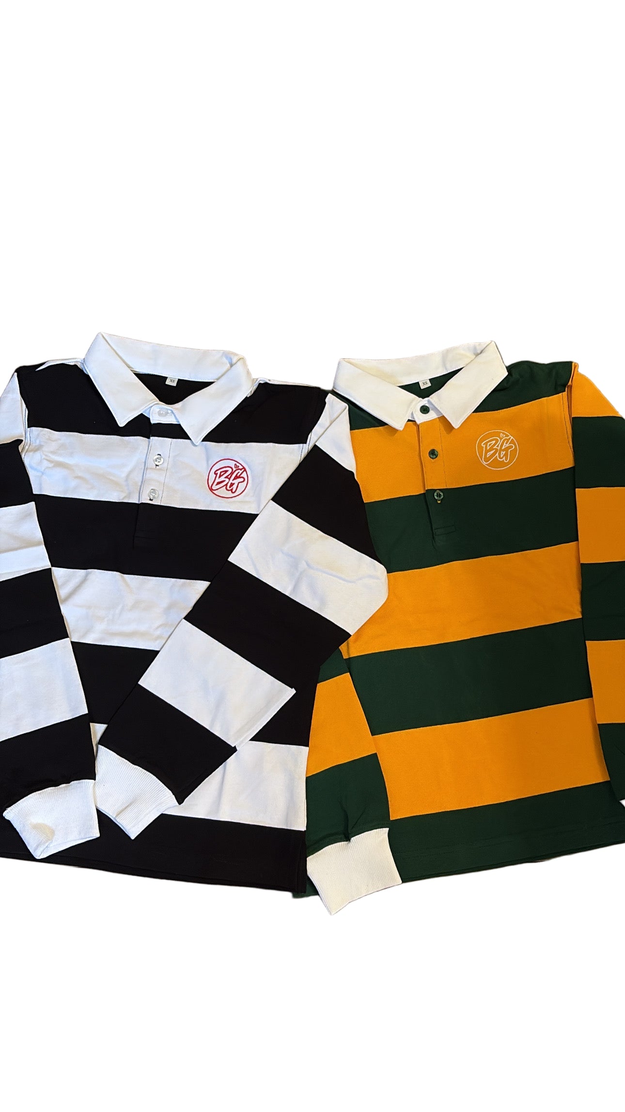 Two striped polo shirts, one black and white and the other green and orange, on a white background.